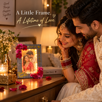 Couple admiring a floral LED photo frame