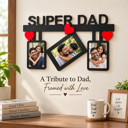 Close-up of the black Super Dad three-photo wall frame with red heart accents on a cream wall.